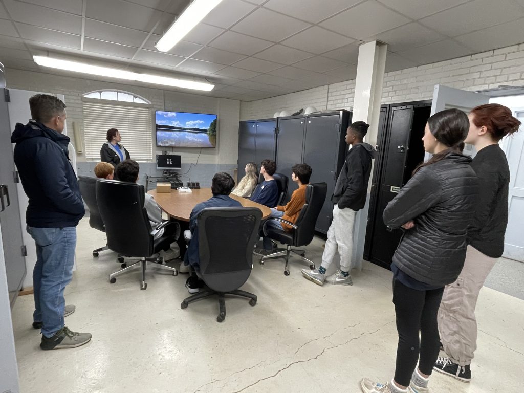 Melanie Vines, Ph.D., shows Vestavia Hills High School students how workers monitor water levels daily.