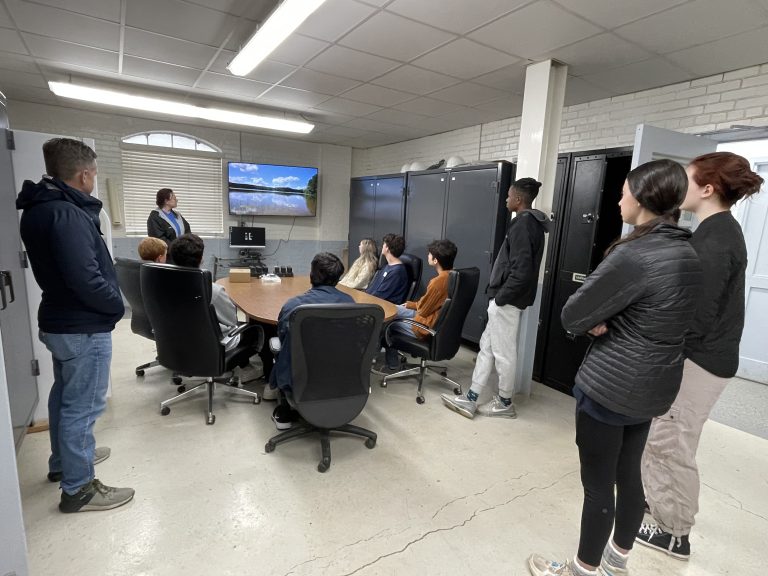 Melanie Vines, Ph.D., shows Vestavia Hills High School students how workers monitor water levels daily.